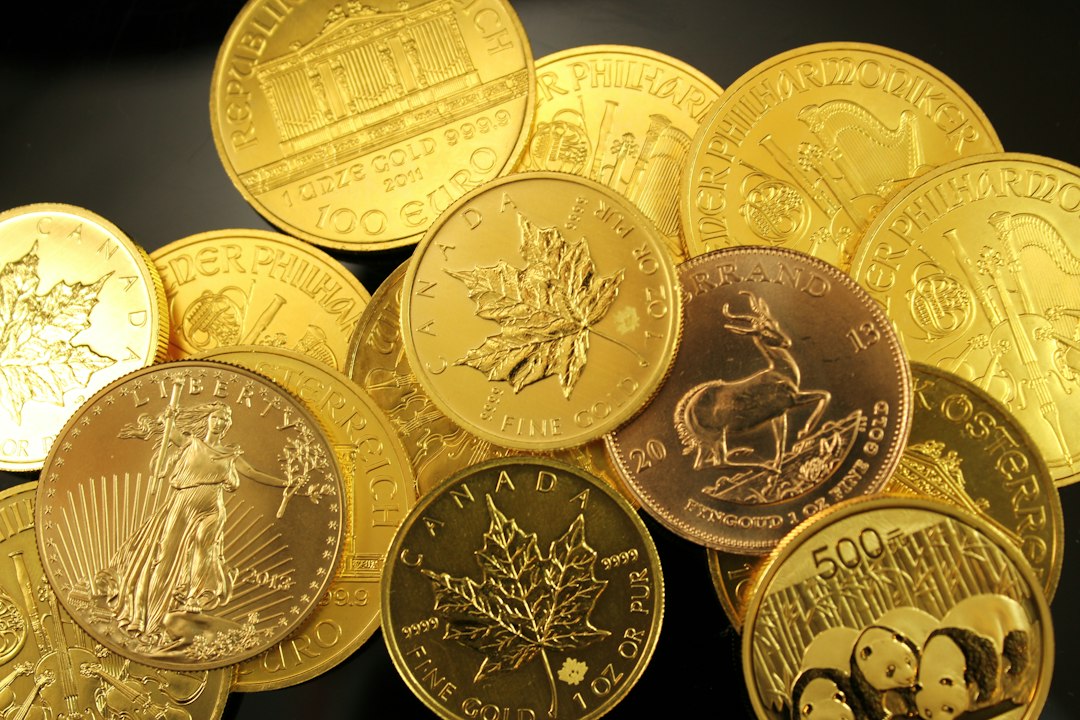 Pile of gold bullion coins from several world mints, representing inherited gold coins