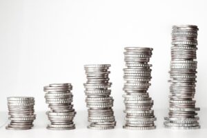 Stacks of old coins, including silver coins, for sale to a Burbank coin dealer